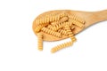 Pasta from durum wheat curls fusilli, cavatappi, unprepared, raw pasta cellentani handmade on the spoon isolated on white backgrou Royalty Free Stock Photo