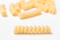 Pasta from durum wheat curls fusilli, cavatappi, unprepared, raw pasta cellentani handmade isolated on white background close up Royalty Free Stock Photo