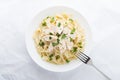 Pasta fettuccine alfredo with chicken, parmesan and parsley on white background top view Royalty Free Stock Photo