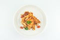 Pasta Fettuccine Bolognese with tomato sauce and prawns and squid in white plate on white background Royalty Free Stock Photo
