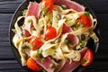 Pasta fettuccine with tuna steak, tomatoes and capers macro. Top Royalty Free Stock Photo