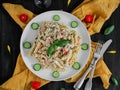 Pasta with fish, vegetables, herbs and cheese sauce. Royalty Free Stock Photo