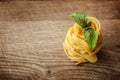 Pasta fresh basil on wood Royalty Free Stock Photo