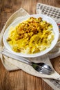 Pasta with fried chicken in cream and chanterelle sauce