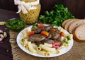 Pasta and fried goose liver (chicken, duck) with pesto and tomato on a wooden background Royalty Free Stock Photo