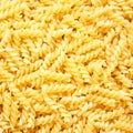 Pasta fusili as background Royalty Free Stock Photo