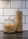 Pasta in glass recepticles in a kitchen.. Royalty Free Stock Photo