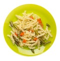 Pasta with green beans with garlicand carrots on a plate isolated on a white background. Mediterranean Kitchen . pasta  top view Royalty Free Stock Photo