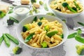 Pasta with green vegetables broccoli, Mange tout and creamy sauce in white plate Royalty Free Stock Photo