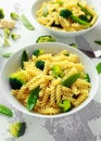 Pasta with green vegetables broccoli, Mange tout and creamy sauce in white plate Royalty Free Stock Photo