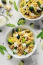 Pasta with green vegetables broccoli, Mange tout and creamy sauce in white plate Royalty Free Stock Photo