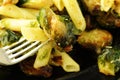 Pasta with green vegetables roasted brussel sprouts and pesto sauce Royalty Free Stock Photo