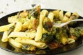 Pasta with green vegetables roasted brussel sprouts and pesto sauce