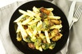 Pasta with green vegetables roasted brussel sprouts and pesto sauce Royalty Free Stock Photo