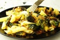 Pasta with green vegetables roasted brussel sprouts and pesto sauce