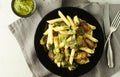 Pasta with green vegetables roasted brussel sprouts and pesto sauce Royalty Free Stock Photo