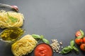 Pasta ingredients for cooking Italian dishes, tagliatelle, tomatoes, basil, oil and garlic