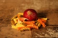 Pasta with ingredients on stone background