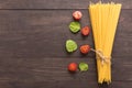 Pasta ingredients. tomato on the wooden background Royalty Free Stock Photo