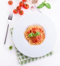 Pasta ingredients - tomatoes, olive oil, garlic, italian herbs, fresh basil, salt and spaghetti on a black stone background Royalty Free Stock Photo