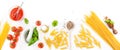 Pasta ingredients - tomatoes, olive oil, garlic, italian herbs, fresh basil and spaghetti on a white board background Royalty Free Stock Photo