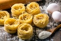 Pasta and ingredients on wooden background Royalty Free Stock Photo