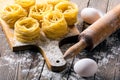 Pasta and ingredients on wooden background Royalty Free Stock Photo