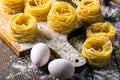 Pasta and ingredients on wooden background Royalty Free Stock Photo