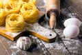 Pasta and ingredients on wooden background Royalty Free Stock Photo