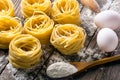 Pasta and ingredients on wooden background Royalty Free Stock Photo