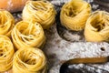 Pasta and ingredients on wooden background Royalty Free Stock Photo