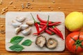 Pasta ingredients on wooden table in kitchen