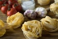 Pasta ingridients and spice on wooden surface. Royalty Free Stock Photo