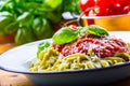 Pasta. Italian and Mediterranean cuisine. Pasta Fettuccine with tomato sauce basil leaves garlic and parmesan cheese. An old home Royalty Free Stock Photo