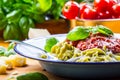 Pasta. Italian and Mediterranean cuisine. Pasta Fettuccine with tomato sauce basil leaves garlic and parmesan cheese. An old home Royalty Free Stock Photo