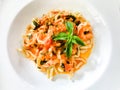 Pasta Italian served with shrimps and basil leaves