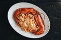 Pasta with Lobster meat on the black background Royalty Free Stock Photo