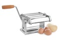 Pasta machine with dough and eggs on white background Royalty Free Stock Photo