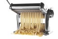 Pasta machine with fresh noodles Royalty Free Stock Photo