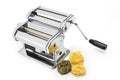 Pasta machine with fresh noodles isolated on white Royalty Free Stock Photo