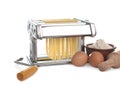 Pasta machine with fresh noodles on white background Royalty Free Stock Photo