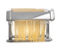 Pasta machine with fresh noodles on white background Royalty Free Stock Photo