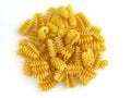 Pasta made of durum wheat top view. Spiral pasta on a white background. Royalty Free Stock Photo