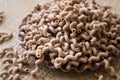 Pasta made from oat flour, scattered on a plate, on a table Royalty Free Stock Photo