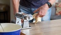 Fresh pasta maker machine. Dough homemade preparation. Hand make dough phylo close up view Royalty Free Stock Photo