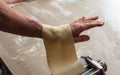 Fresh pasta maker machine. Dough homemade preparation. Hand make dough phylo close up view Royalty Free Stock Photo