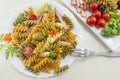 Pasta meal cooked with vegetables with fresh vegetables served o