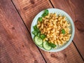 Pasta with minced meat and basil leaves on a salad plate close-up top view Royalty Free Stock Photo