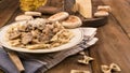 Pasta with mushrooms and tigelle. Butterfly pasta with parmesan and cheese sauce. Typical italian cuisine from the south