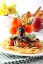 Pasta with octopus and tomato Royalty Free Stock Photo